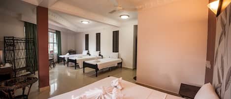 Family Room | Minibar, in-room safe, individually decorated, individually furnished