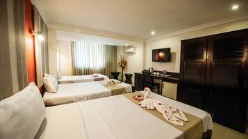 Superior Triple Room | Minibar, in-room safe, individually decorated, individually furnished