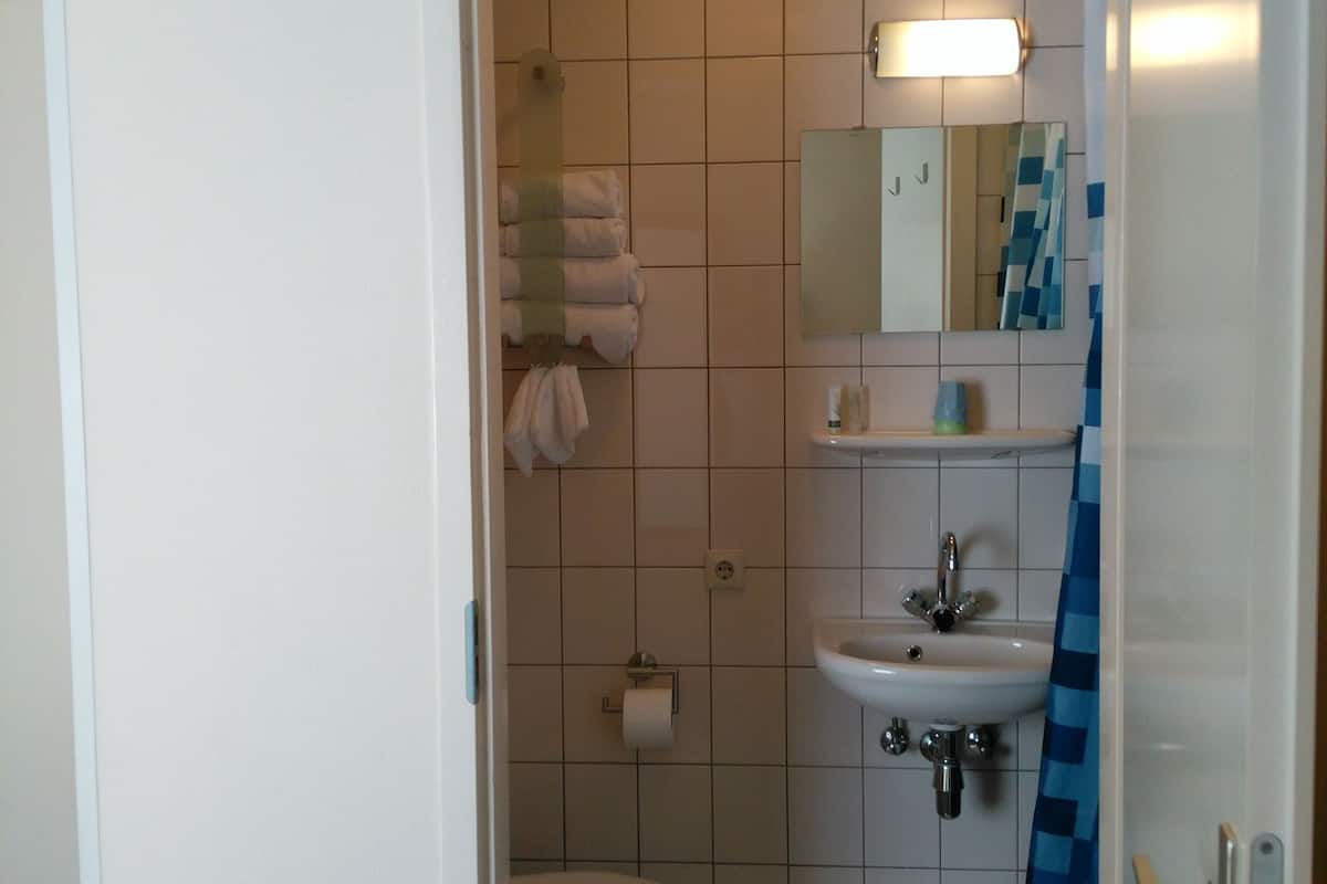 twin room (small) | bathroom | shower, hair dryer, towels