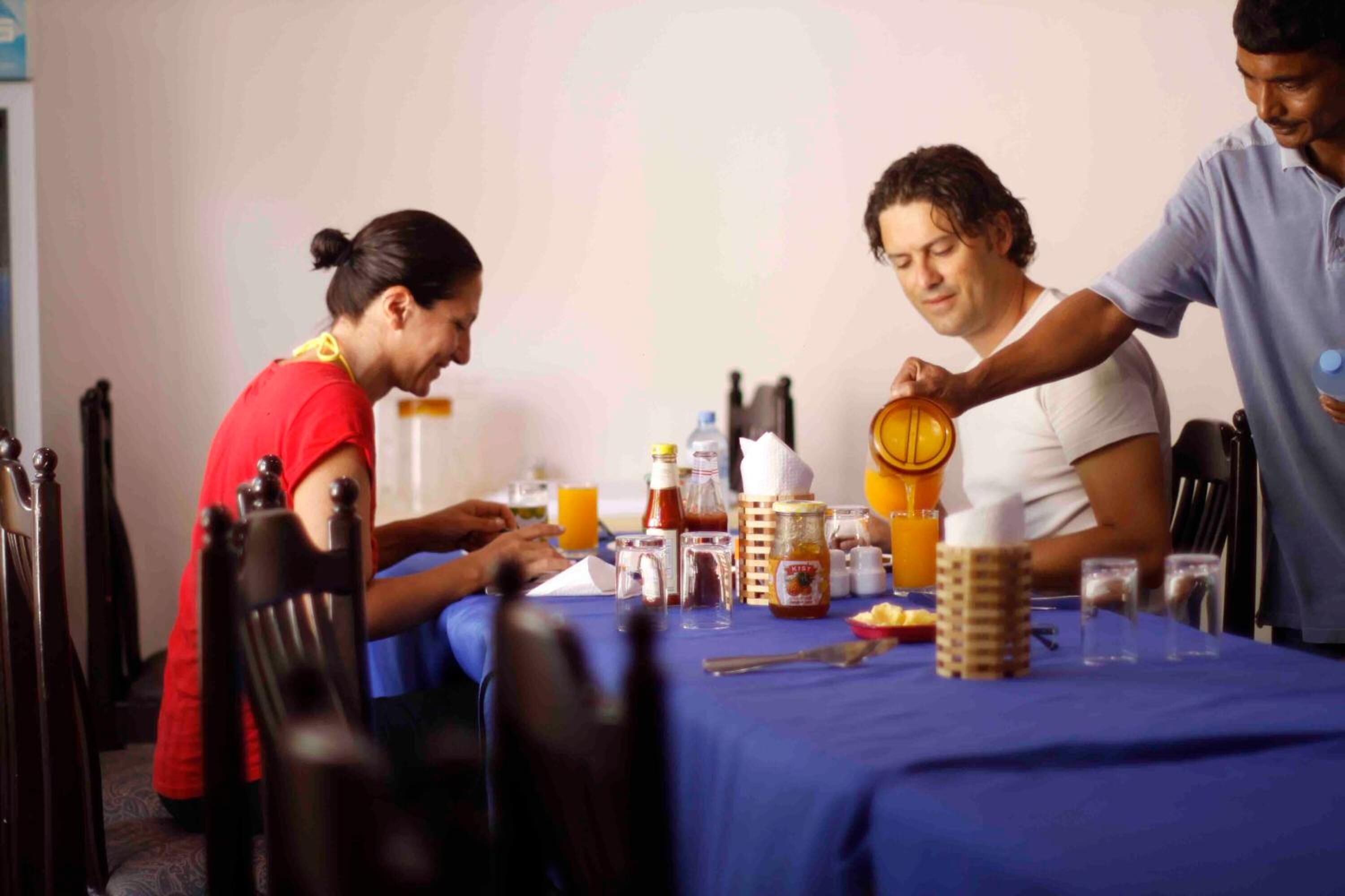 A dining table with various food items and condiments.