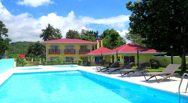 Outdoor pool, pool umbrellas, sun loungers