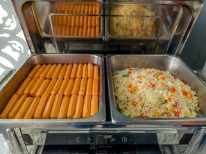 A buffet with hot dogs and fried rice. - Sino Imperial Design Hotel (Phuket)