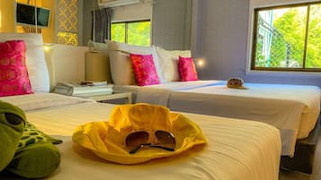 Family Room | Minibar, in-room safe, individually decorated, desk