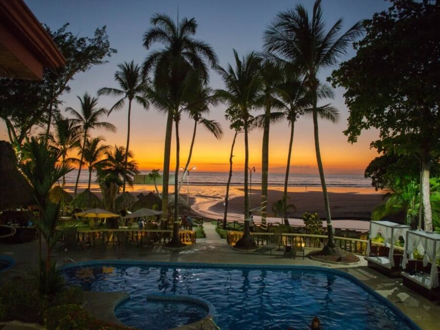 2 outdoor pools, open 6:30 AM to 10 PM, pool umbrellas, pool loungers