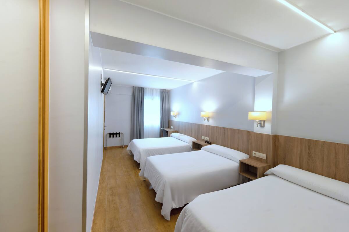 quadruple room | desk, laptop workspace, blackout curtains, iron/ironing board