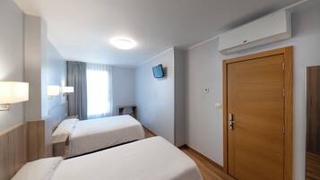 Desk, laptop workspace, blackout drapes, iron/ironing board