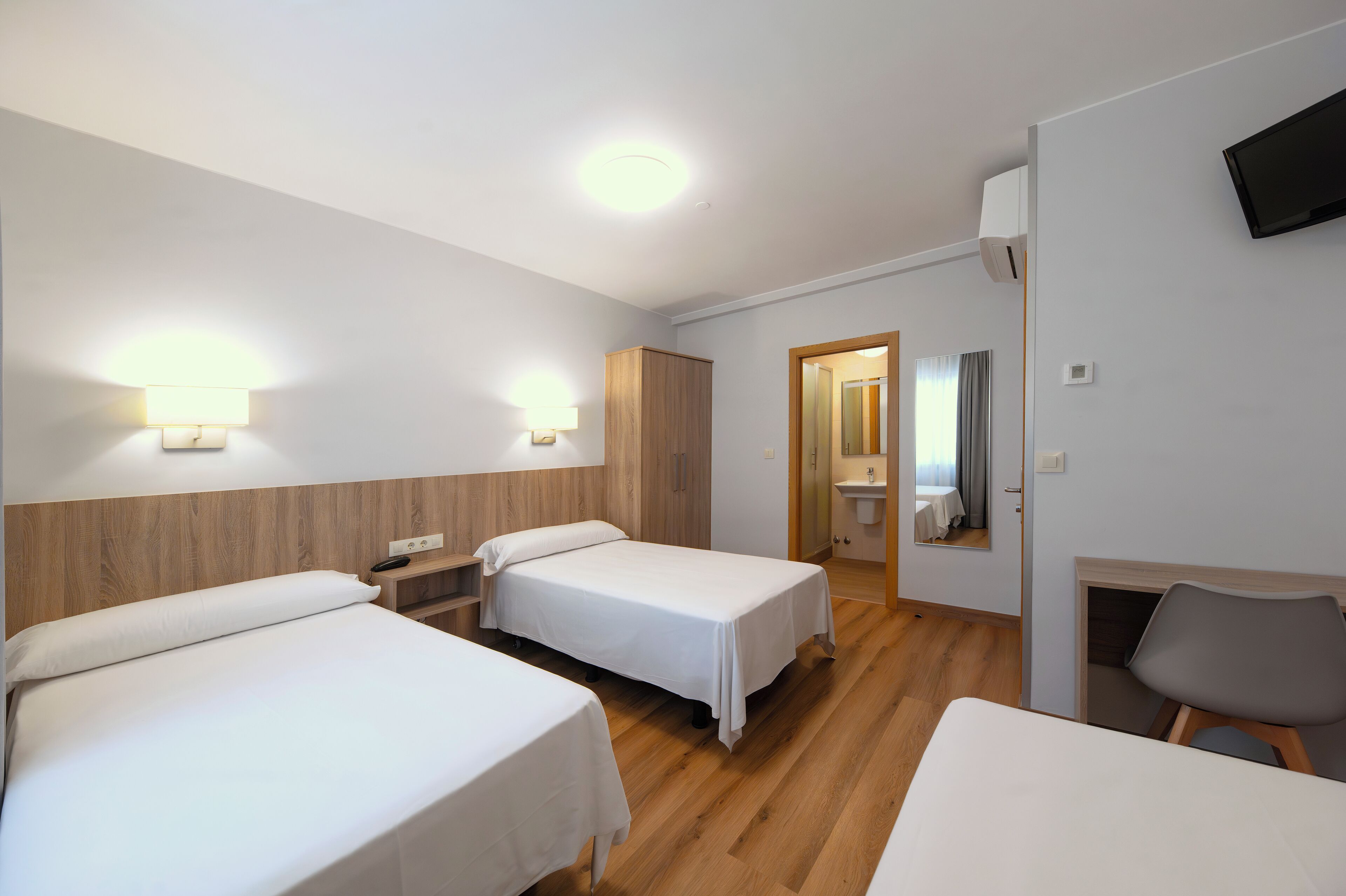 triple room | desk, laptop workspace, blackout curtains, iron/ironing board