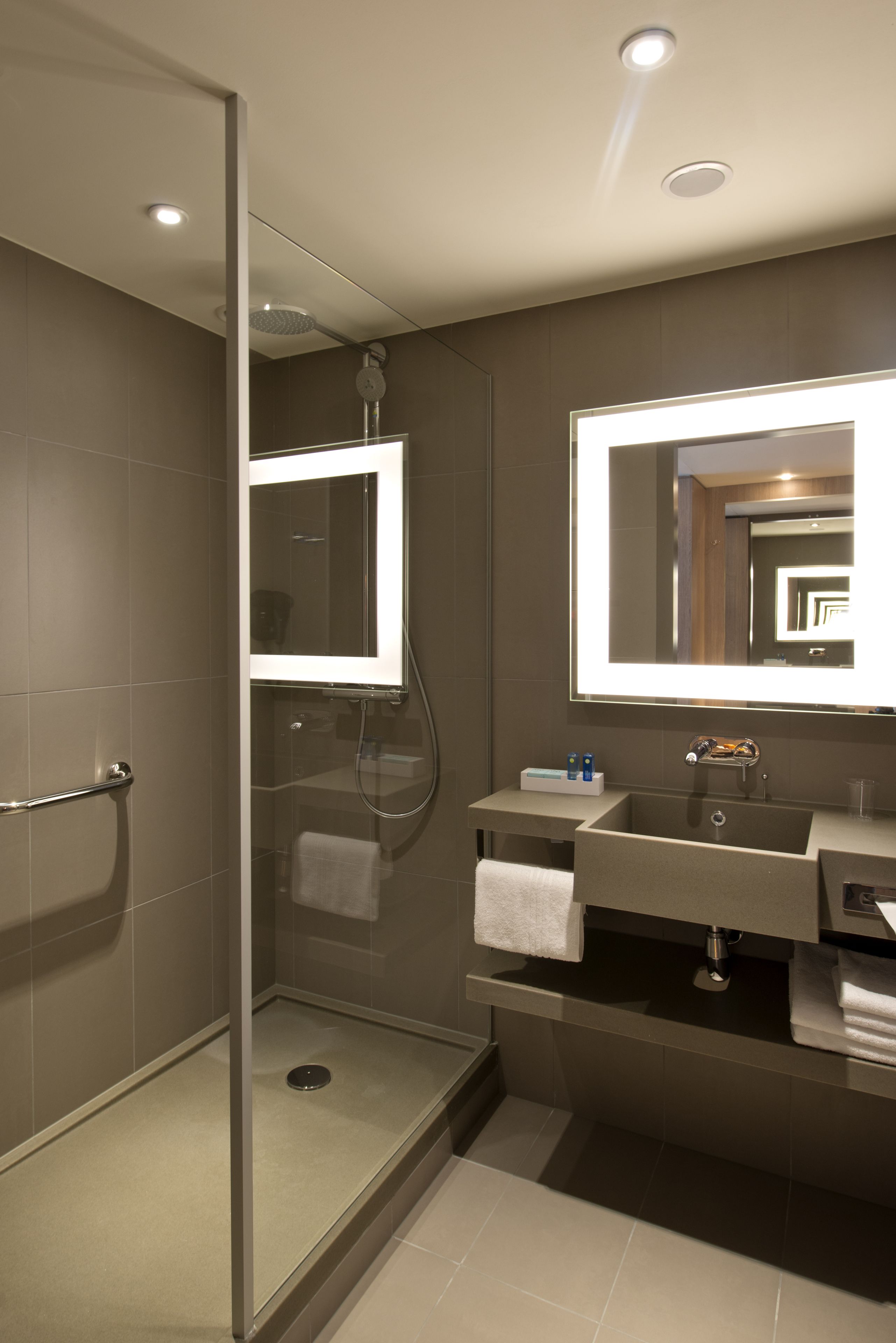 rainfall showerhead, designer toiletries, hair dryer, towels