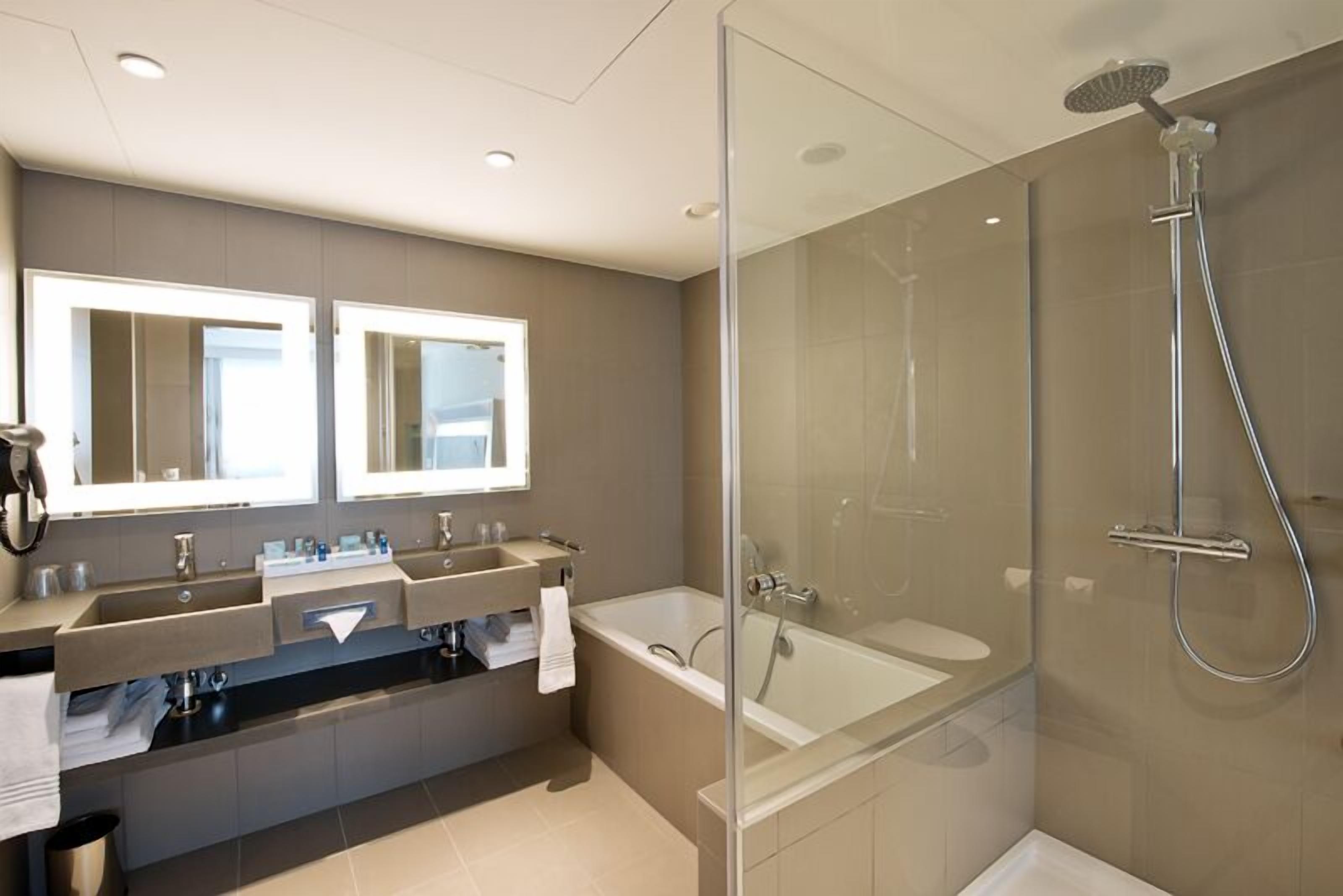 rainfall showerhead, designer toiletries, hair dryer, towels