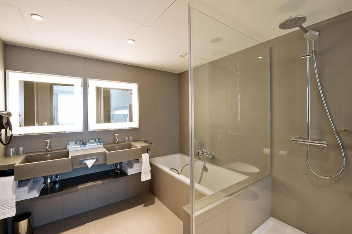 rainfall showerhead, designer toiletries, hair dryer, towels