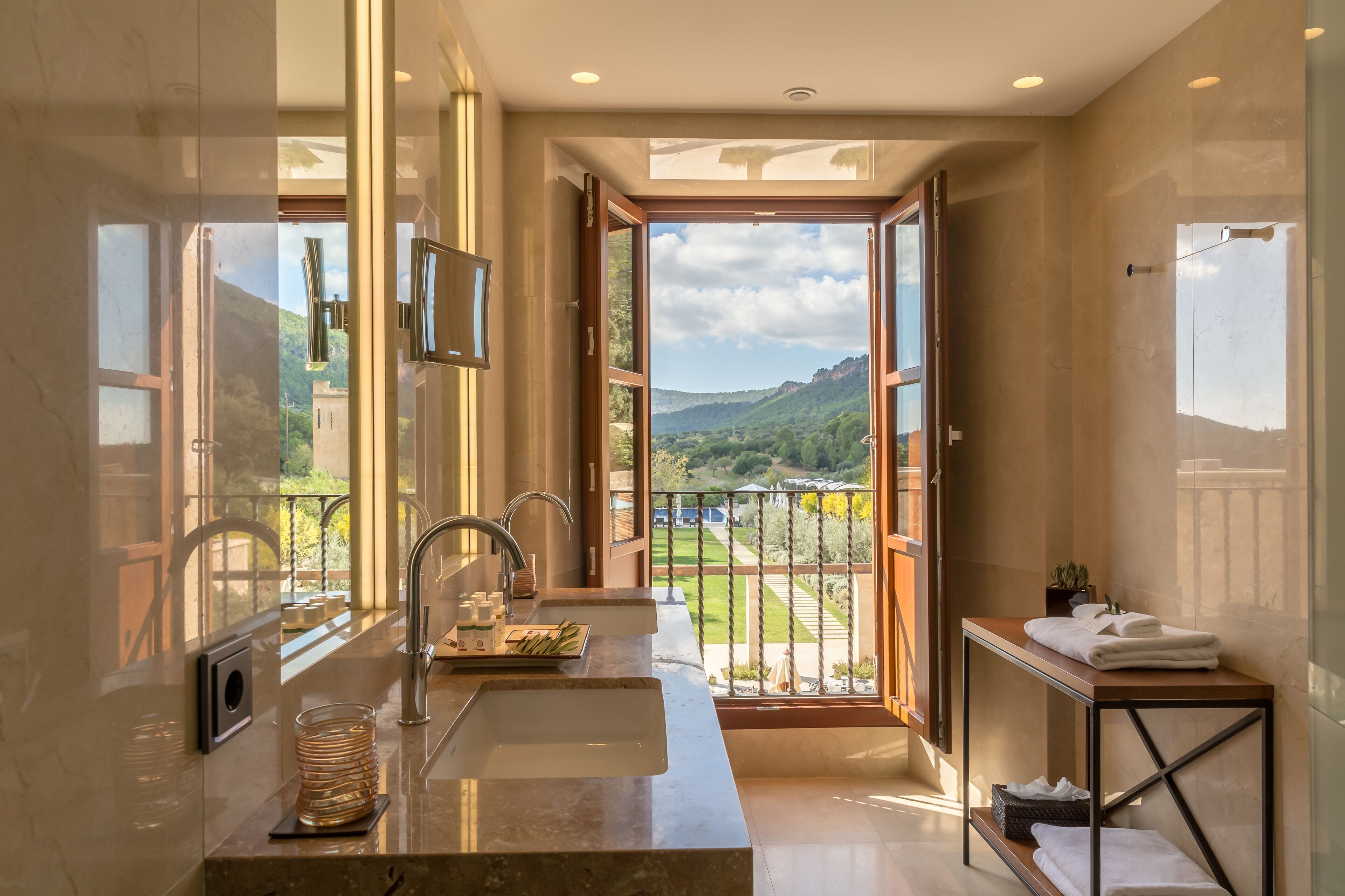 rainfall showerhead, designer toiletries, hair dryer, bathrobes