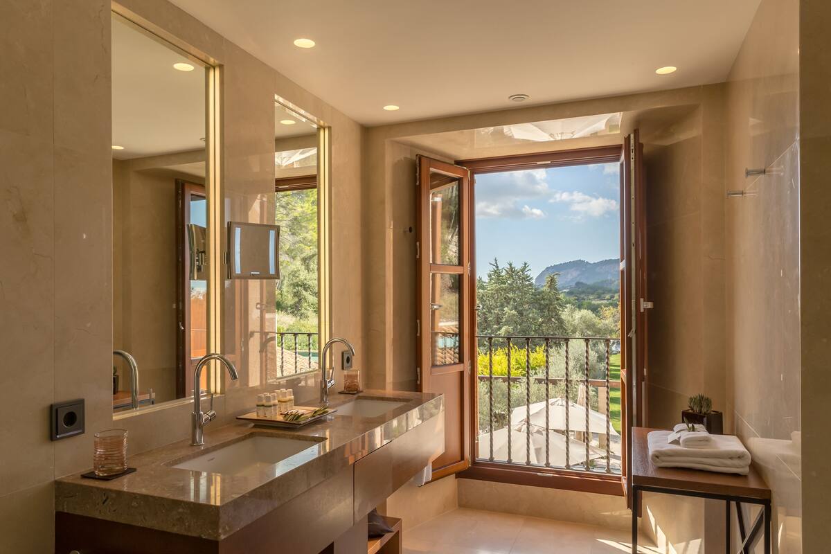 rainfall showerhead, designer toiletries, hair dryer, bathrobes