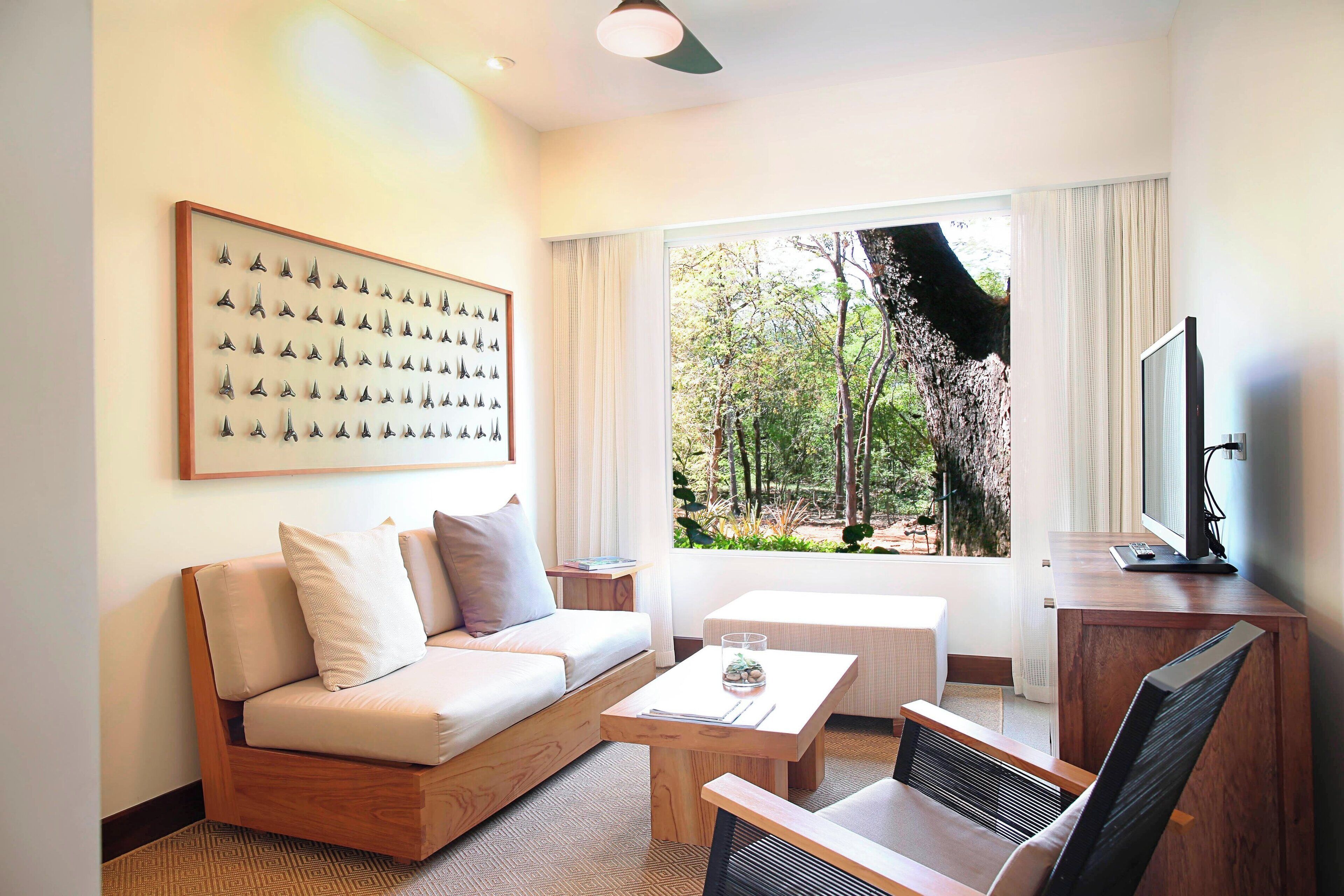 superior suite, 1 bedroom, balcony | living room | 42-inch plasma tv with digital channels, tv, ipod dock