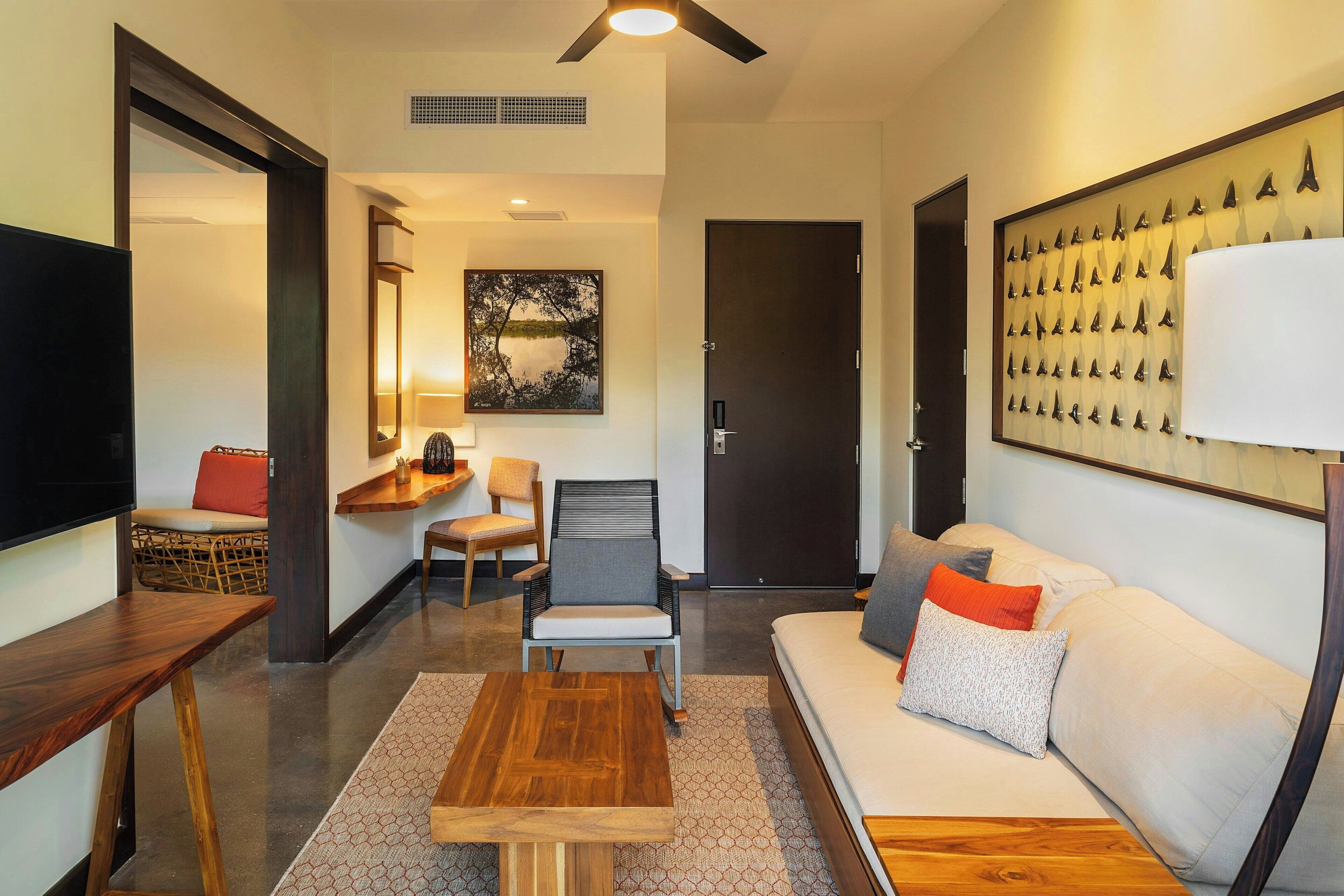 suite, 1 king bed | living room | 42-inch plasma tv with digital channels, tv, ipod dock