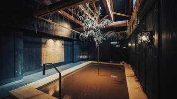 Relax by the pool surrounded by a simple design and natural elements.