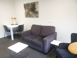 Superior Apartment, 1 Bedroom (King Bed) | Living room | 46-inch LCD TV with premium TV channels, TV