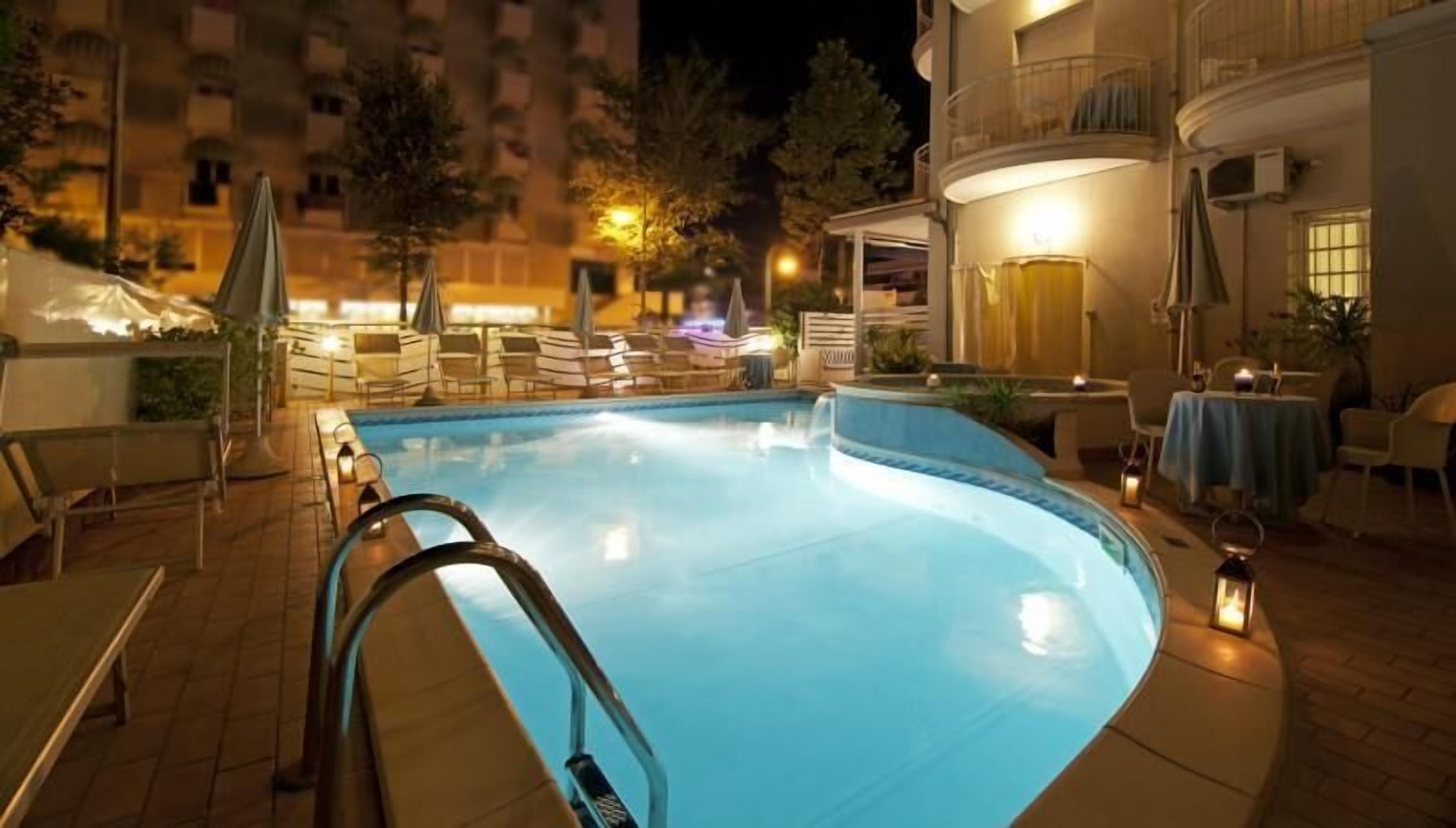 seasonal outdoor pool, open 9:00 am to 7:00 pm, pool umbrellas