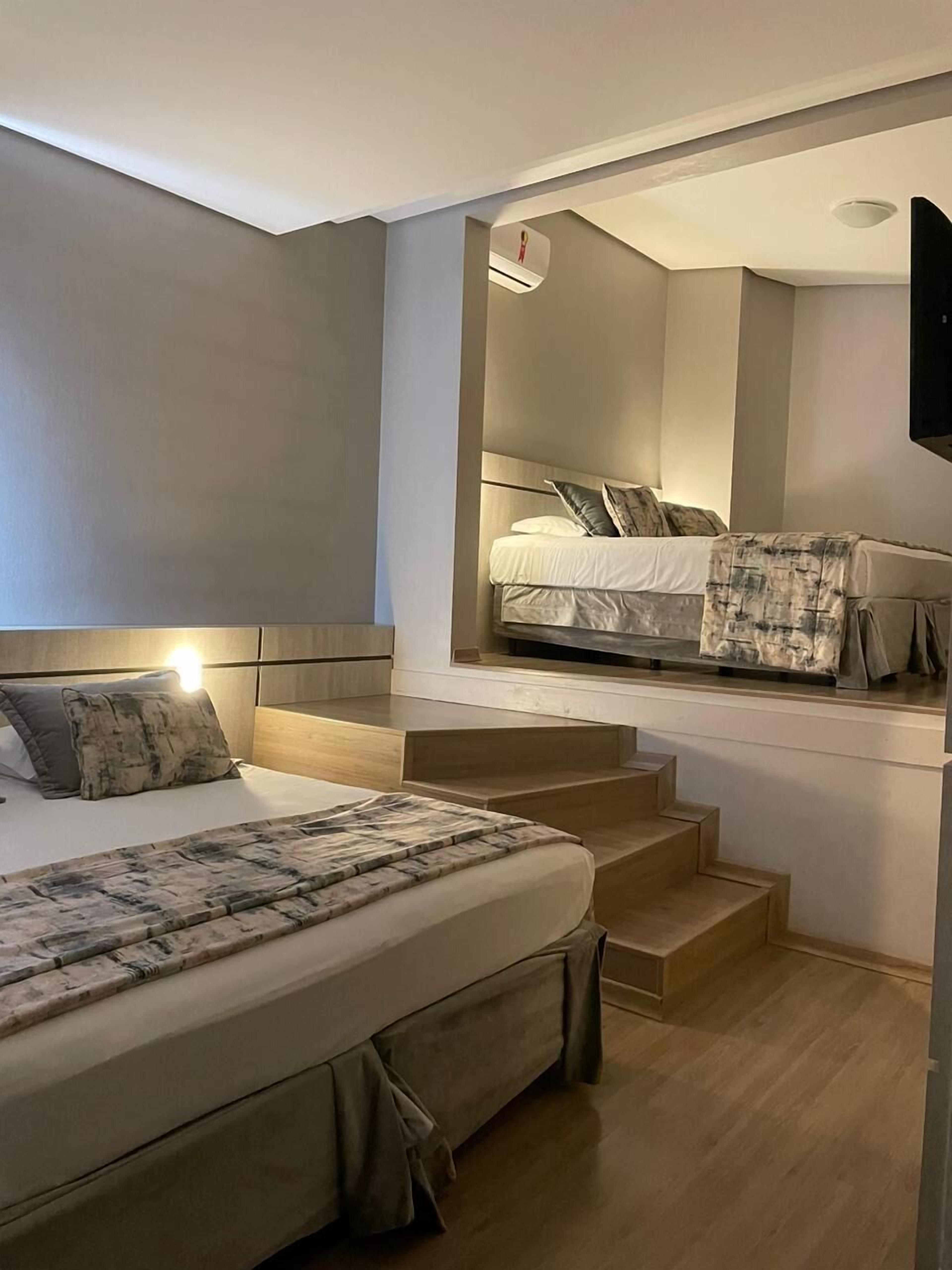 Habitación cuádruple Deluxe | Minibar, cortinas blackout y insonorización 