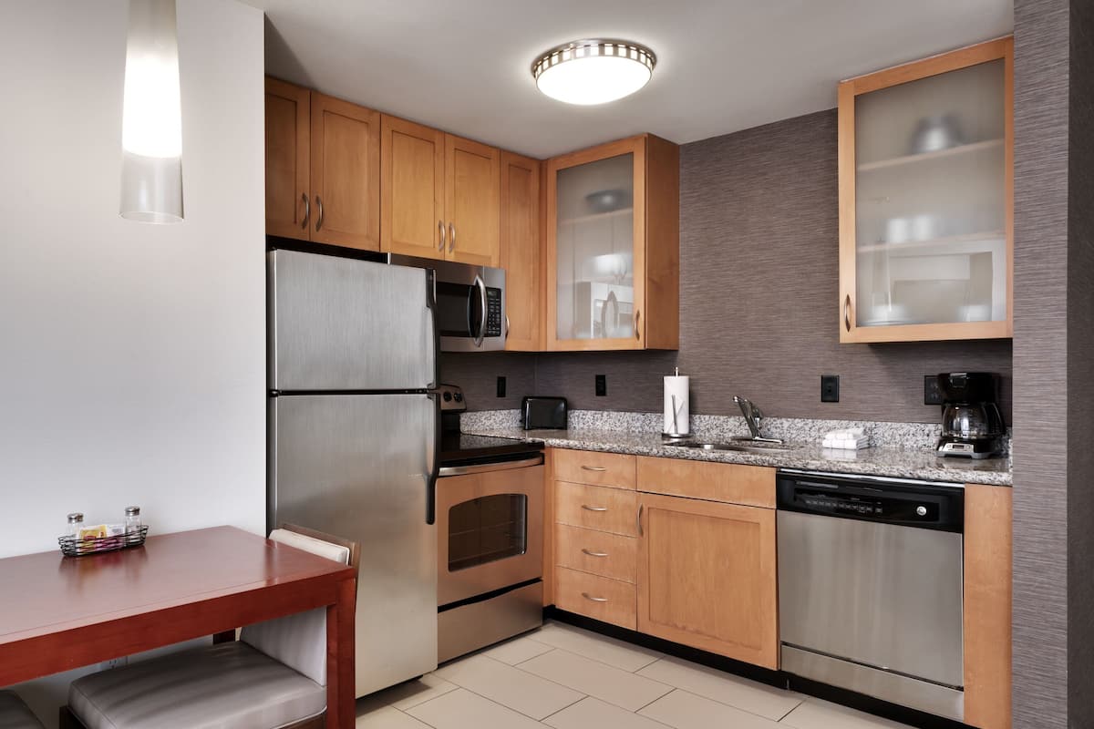 full-sized fridge, microwave, stovetop, dishwasher