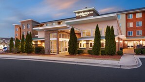 A multi-story hotel with a modern design, featuring a prominent entrance with a covered walkway and a sign reading "Residence Inn by Marriott". - Residence Inn by Marriott Greenville (Greenville)