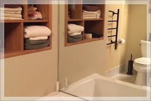 Premium Suite | Bathroom | Combined shower/tub, deep soaking tub, hydromassage showerhead
