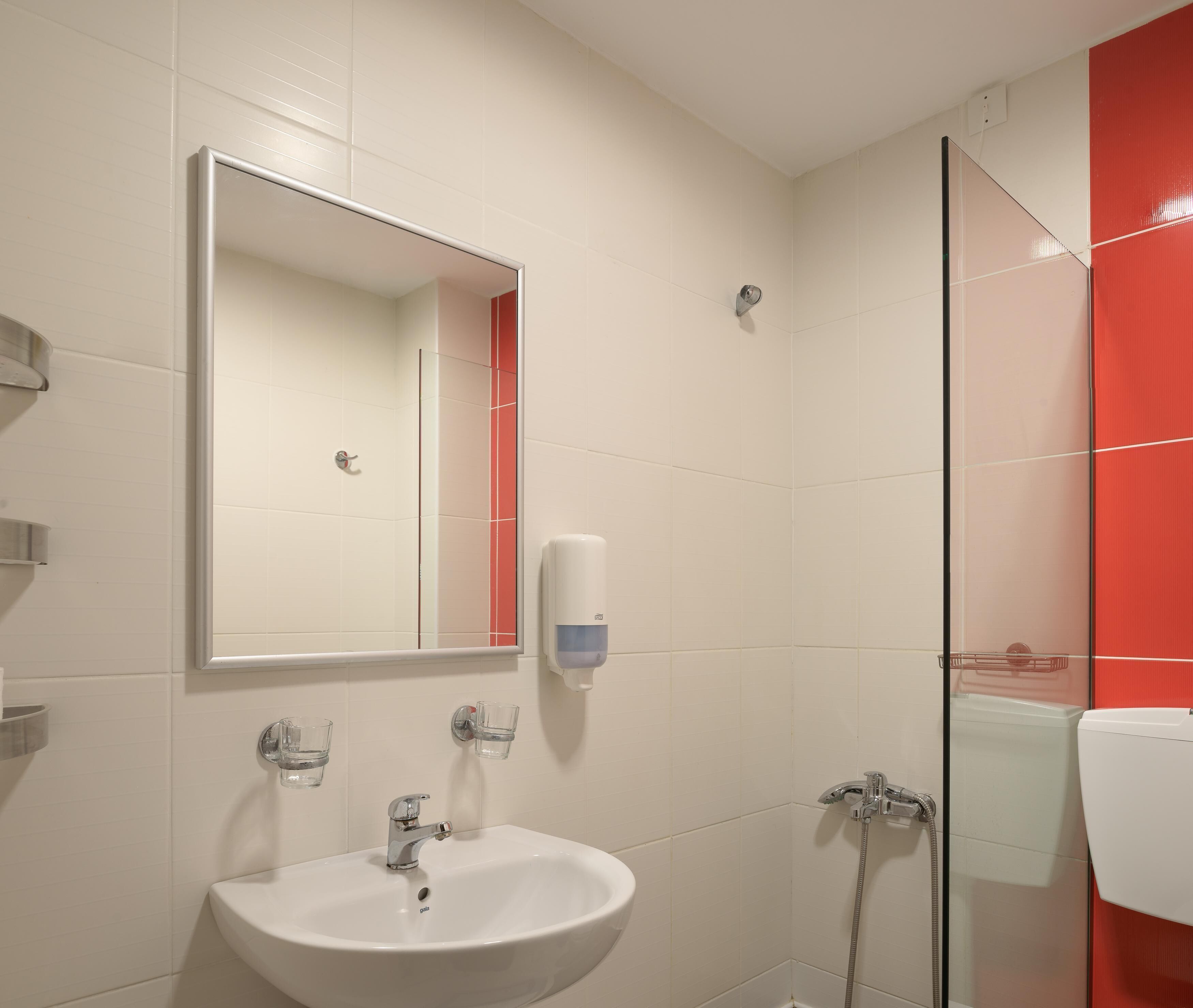 standard room | bathroom | shower, rainfall showerhead, hair dryer, towels