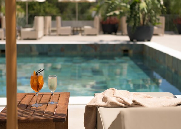 Outdoor pool, pool umbrellas, pool loungers