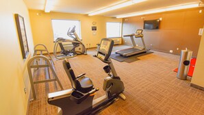 A fitness center with treadmills, elliptical machines, and a stair climber. - Canad Inns Destination Centre Health Sciences Centre (Winnipeg)