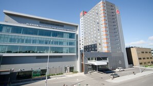 A modern building with a sign reading "Kleysen Institute for Advanced Medicine." - Canad Inns Destination Centre Health Sciences Centre (Winnipeg)