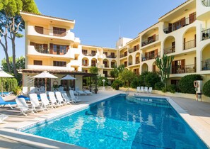 Outdoor pool, open 10:00 AM to 6:00 PM, pool umbrellas, pool loungers