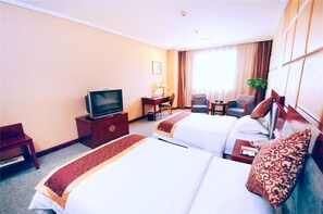 A hotel room with two beds, a desk, a chair, a television, and a window with curtains. - Days Inn By Wyndham City Centre Xian (Xi'an)