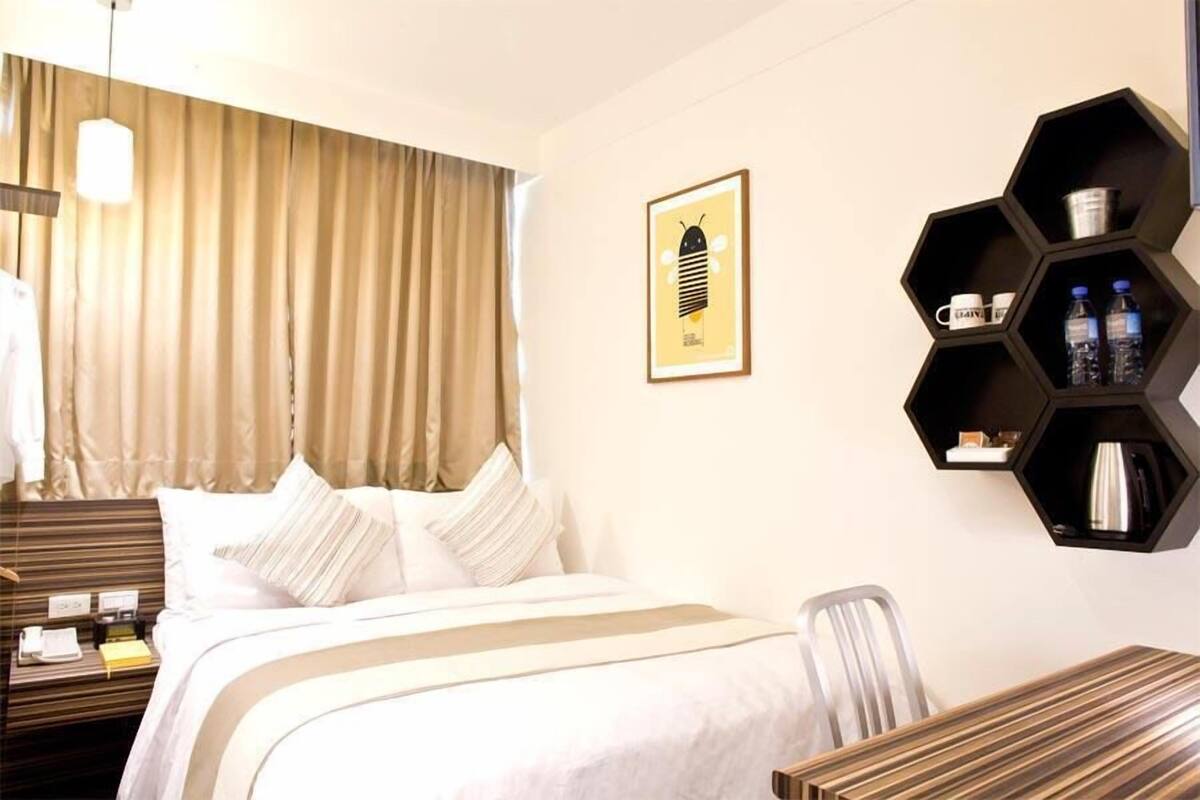 Edredón, camas con pillow-top y caja de seguridad en la habitación