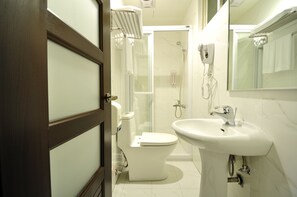 Shower, hair dryer, slippers, towels