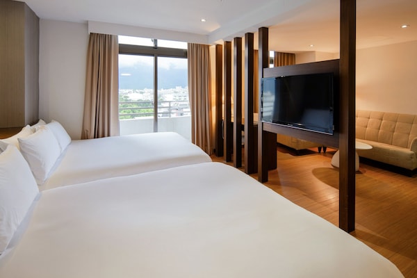 Family Quadruple Room | Down comforters, in-room safe, individually decorated