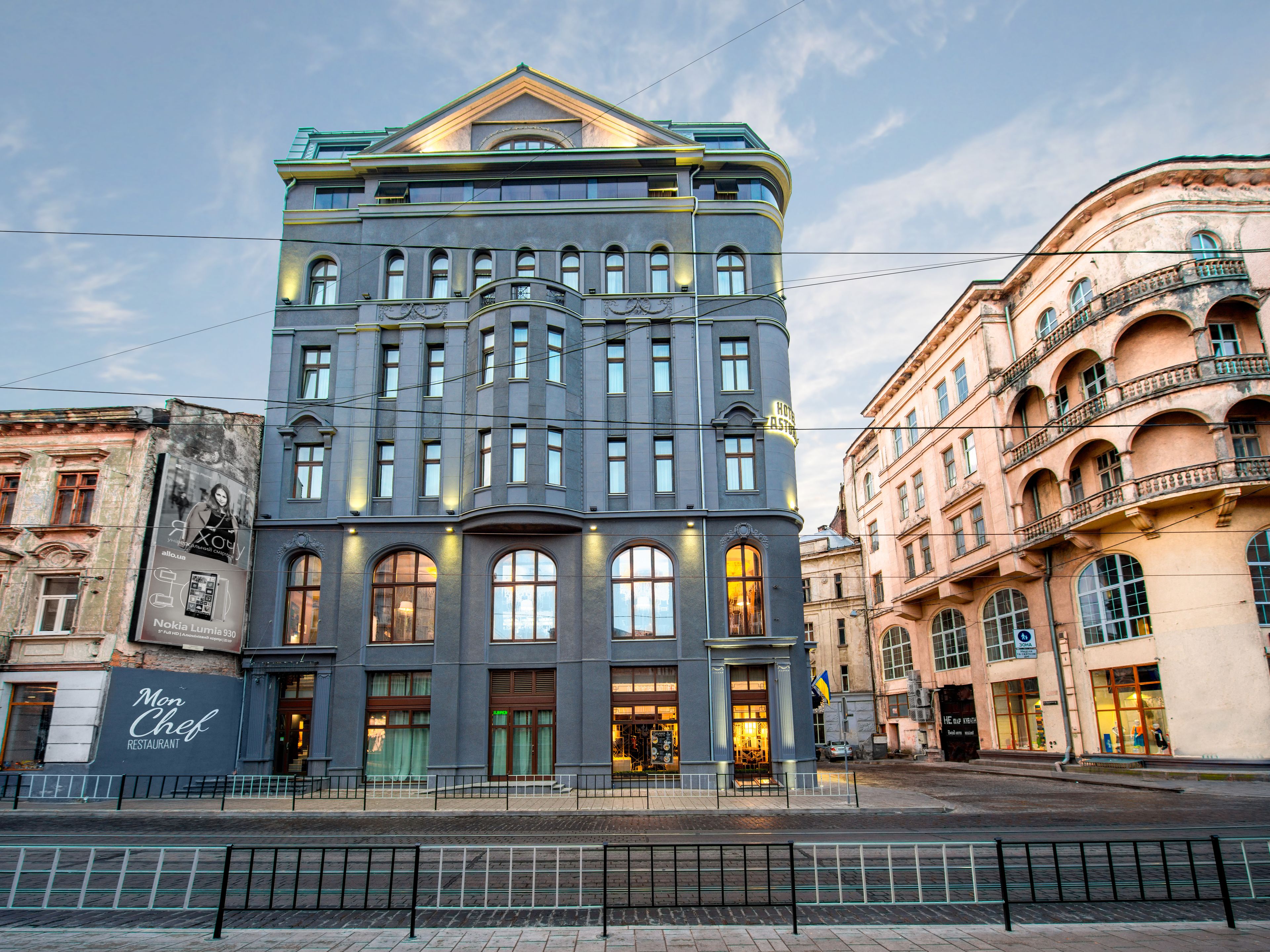 A historic building with a classic architectural style, featuring multiple windows and a prominent entrance.