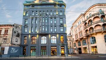 A historic building with a classic architectural style, featuring multiple windows and a prominent entrance.