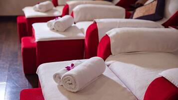 Massage therapy rooms offer a variety of comfort options with cushioned chairs and unique pillows.