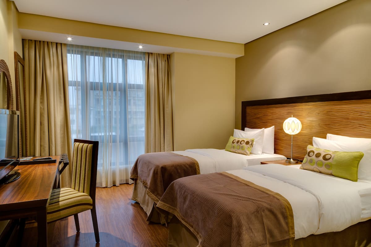 premium bedding, down duvets, minibar, in-room safe