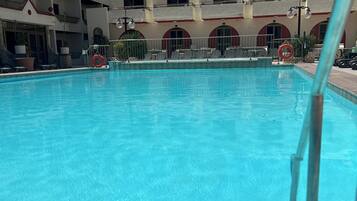 Outdoor pool, pool umbrellas, pool loungers