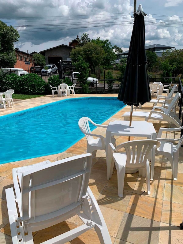 Outdoor pool, pool umbrellas, pool loungers