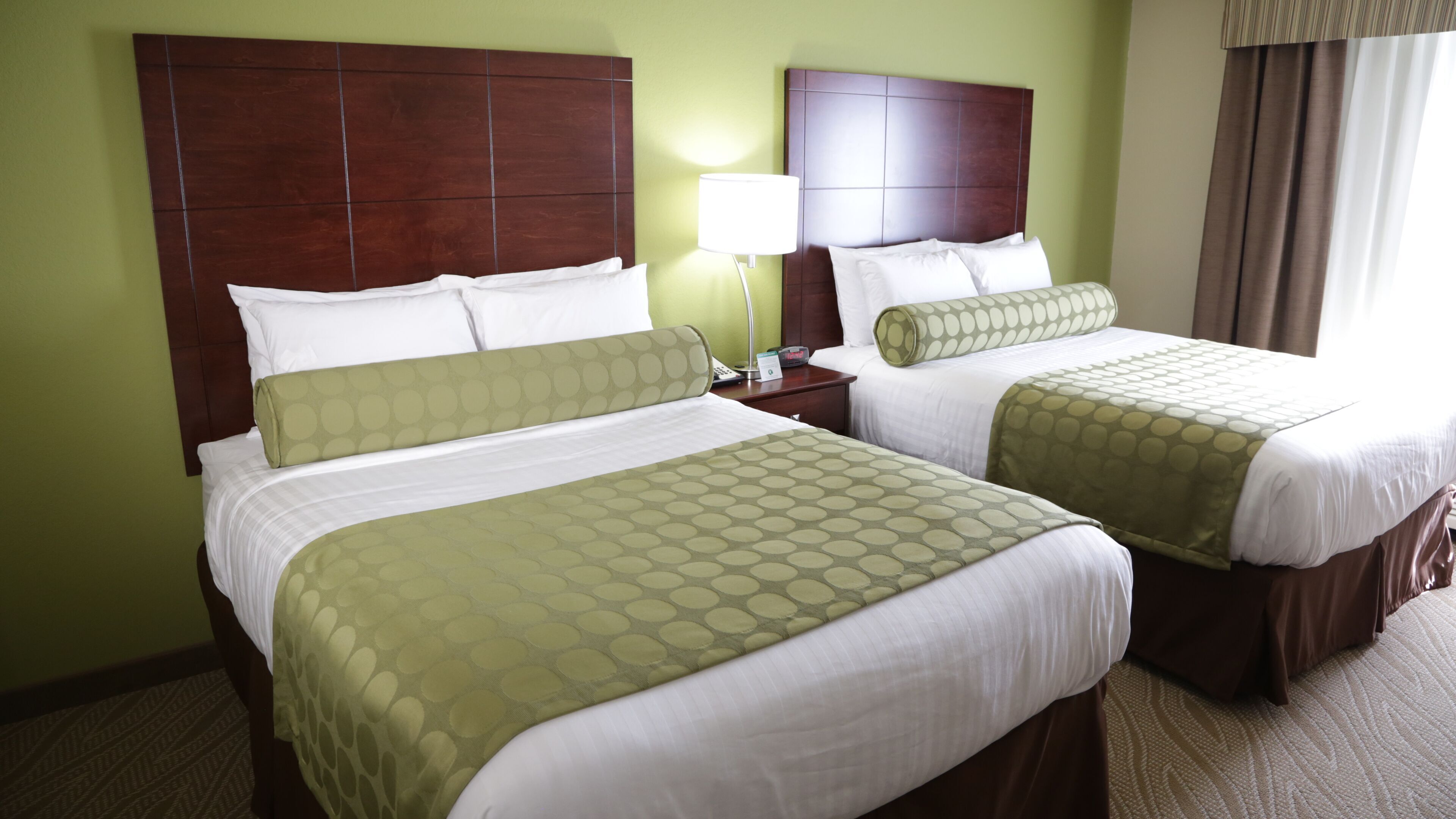 Premium bedding, down comforters, pillowtop beds, in-room safe