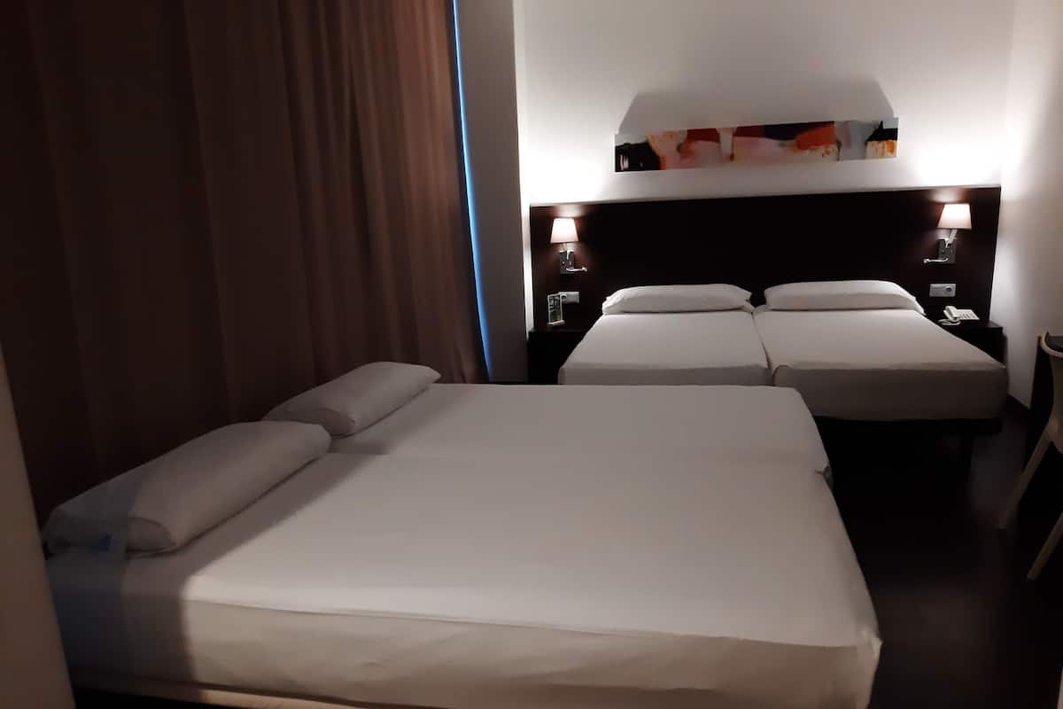 Classic Quadruple Room | Down comforters, in-room safe, desk, blackout drapes