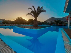 Outdoor pool, open 8:00 AM to 8:30 PM, pool umbrellas, sun loungers