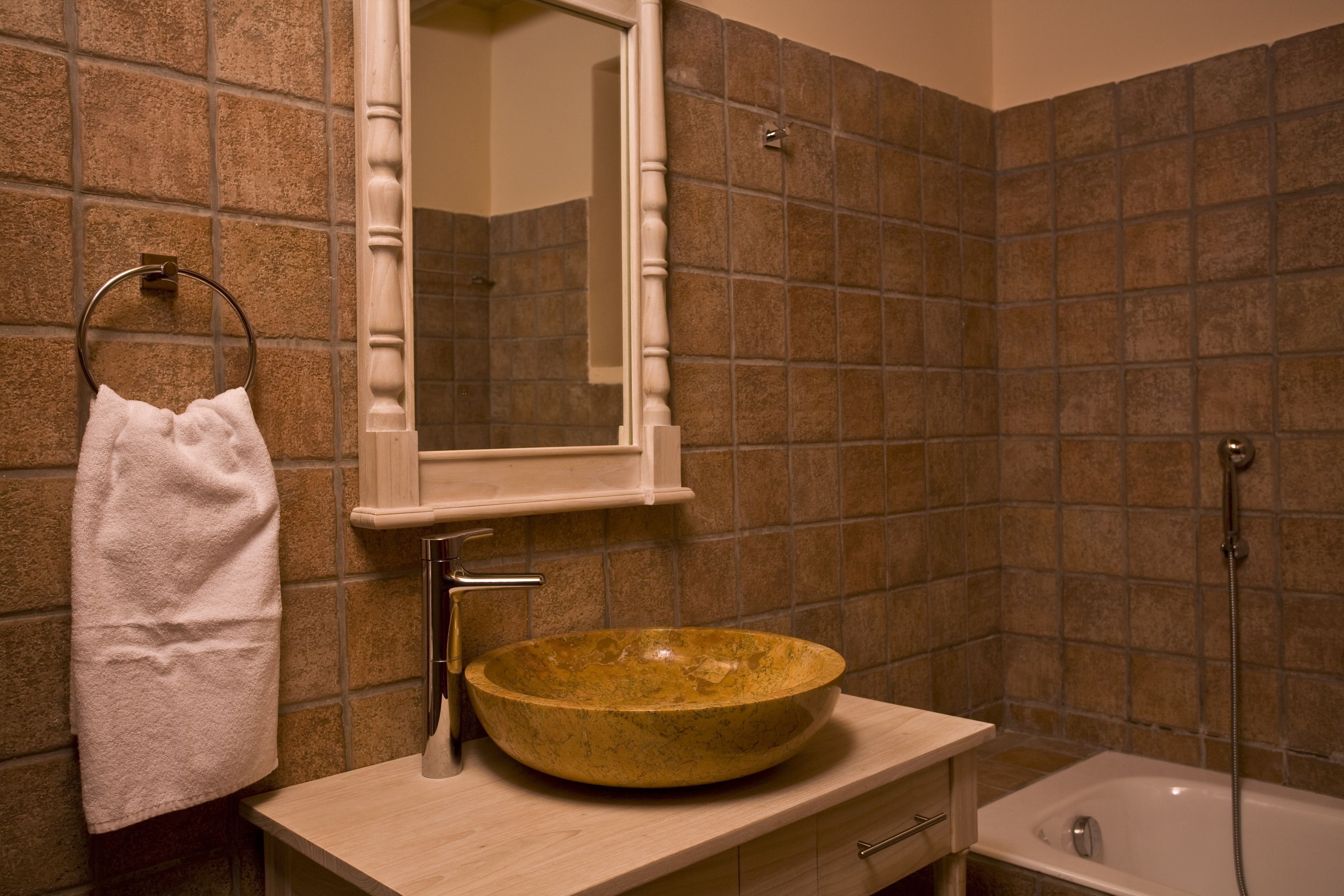 designer toiletries, hair dryer, towels