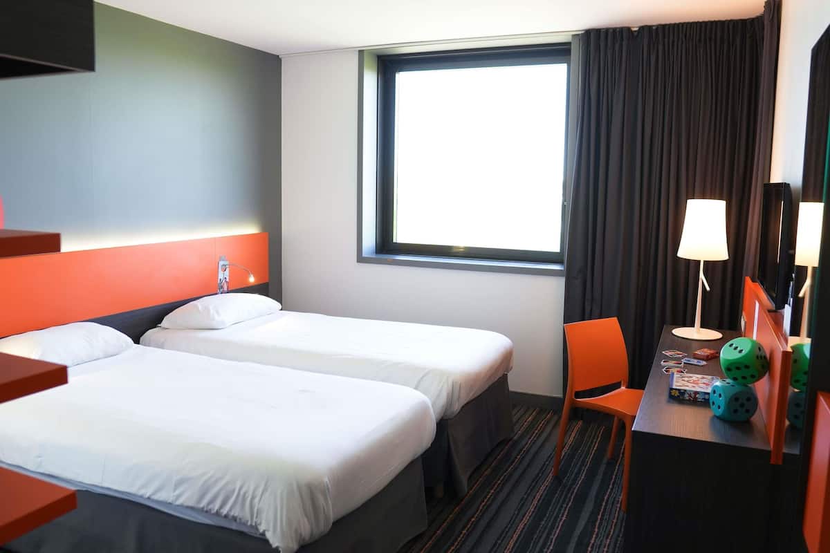 Premium bedding, memory foam beds, in-room safe, desk