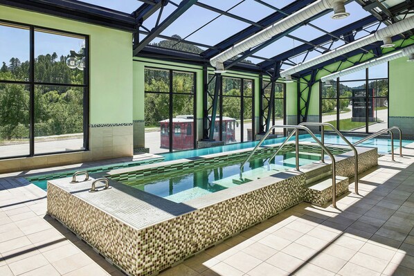 Indoor pool, open 6 AM to midnight, sun loungers