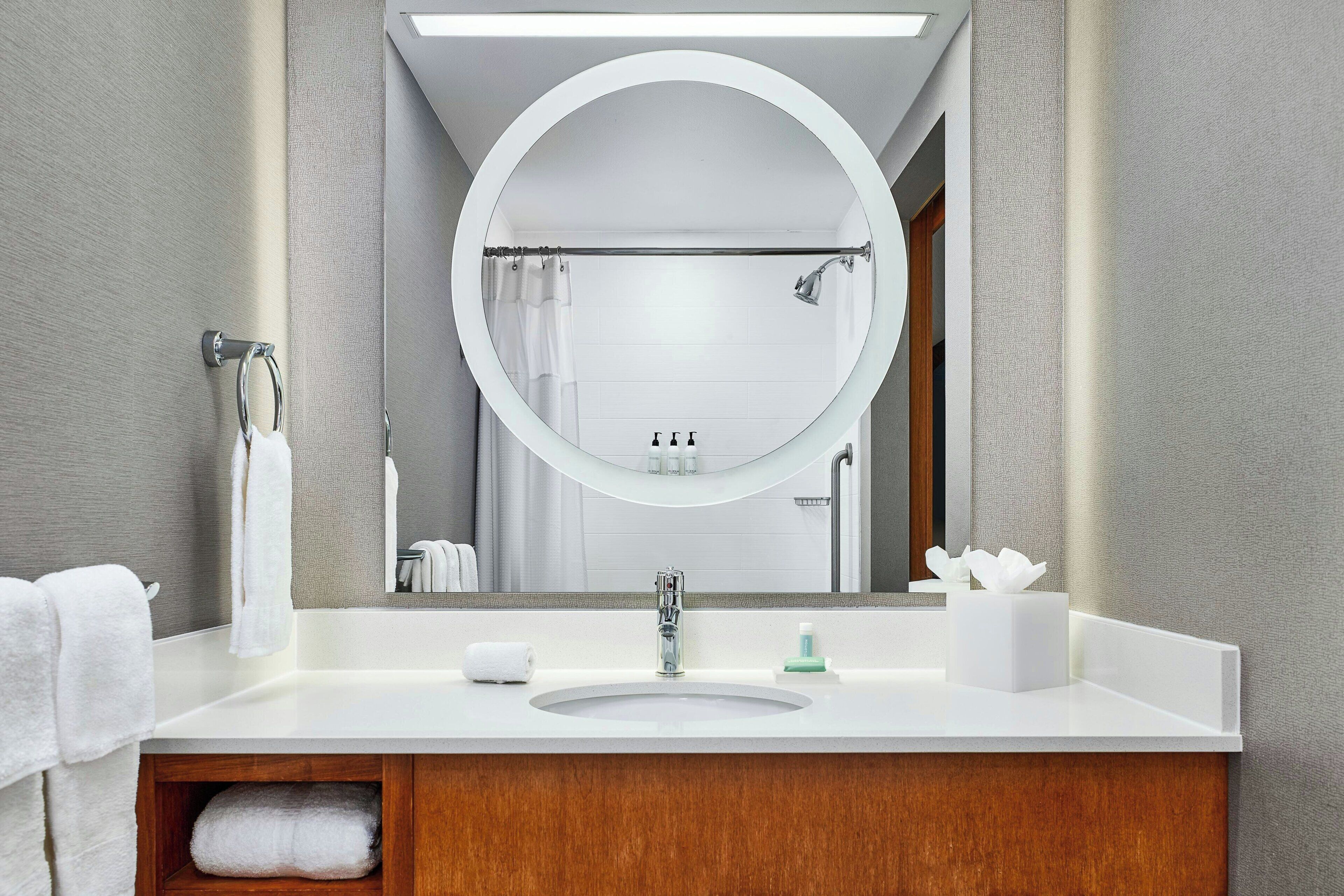 rainfall showerhead, designer toiletries, hair dryer, towels