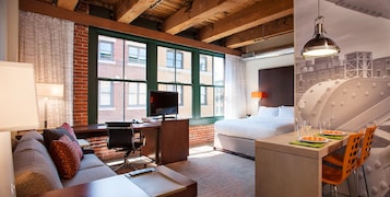 Hypo-allergenic bedding, desk, laptop workspace, blackout drapes