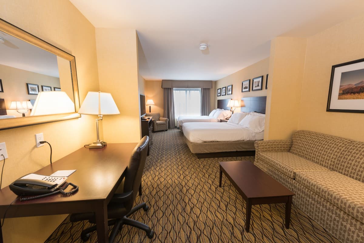 suite, 2 queen beds, non smoking | living area | flat-screen tv