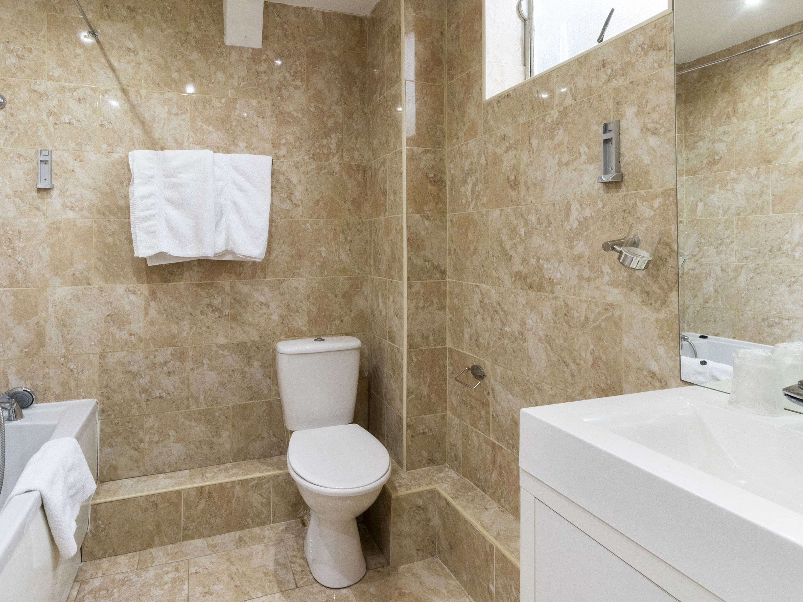 standard quadruple room, 2 double beds | bathroom | combined shower/bathtub, free toiletries, hair dryer, towels